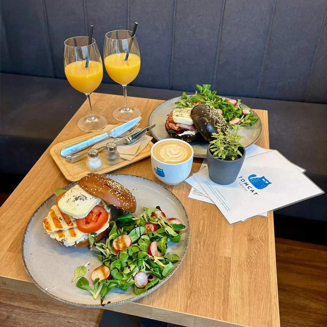 Sandwiches with fresh salad and orange juice